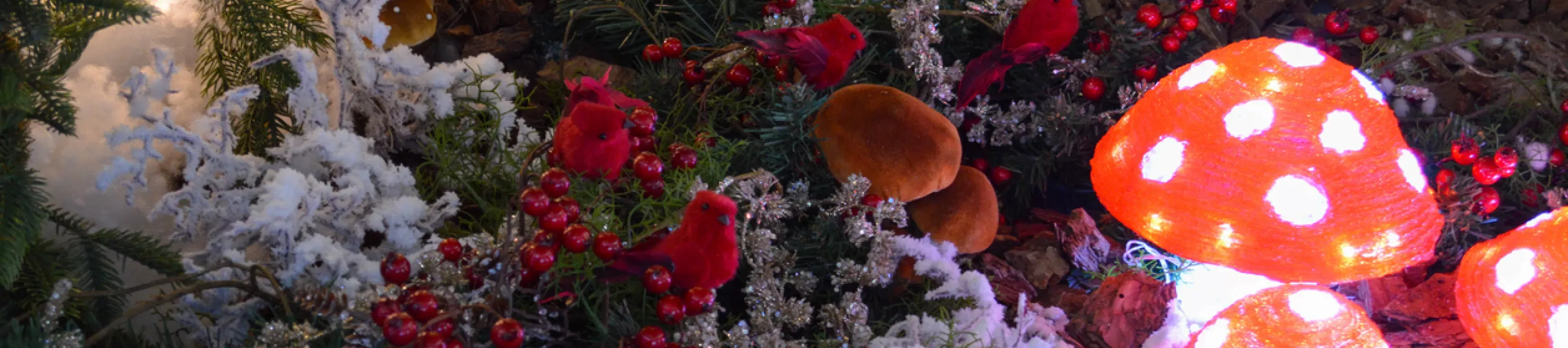 glowing red and white mushrooms under foliage decorations